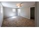 Spacious bedroom with neutral tones, plush carpeting, and ample natural light at 6225 Pebble Dr, Douglasville, GA 30135