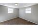 Clean, bright bedroom offers new carpet, neutral paint, and abundant natural light from two windows at 6225 Pebble Dr, Douglasville, GA 30135
