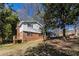 Exterior view shows a well-maintained house with a wooden deck and a partially wooded backyard at 6225 Pebble Dr, Douglasville, GA 30135