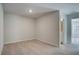 Bedroom featuring wall-to-wall carpet and access to ensuite bathroom at 907 Eagle Ave, Riverdale, GA 30296
