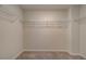 Walk-in closet with wire shelving and neutral walls, with wall-to-wall carpet at 907 Eagle Ave, Riverdale, GA 30296