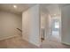Hallway features laundry closet with washer and dryer hookups and carpet at 907 Eagle Ave, Riverdale, GA 30296