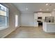Bright, modern kitchen with stainless steel appliances, island, and door to the backyard at 907 Eagle Ave, Riverdale, GA 30296