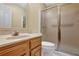 Bathroom with a frosted-glass shower stall, wood vanity and toilet at 1236 Whitlock Ridge Sw Dr, Marietta, GA 30064