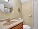 Well-lit bathroom featuring a vanity with a single sink, toilet and shower with curtain at 1236 Whitlock Ridge Sw Dr, Marietta, GA 30064