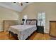 Bedroom with hardwood floors, neutral walls, plantation shutters and a ceiling fan at 1236 Whitlock Ridge Sw Dr, Marietta, GA 30064