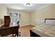 Bedroom with hardwood floors, neutral walls, study desk and bed at 1236 Whitlock Ridge Sw Dr, Marietta, GA 30064