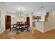 Charming dining room with chandelier, table set, and connection to the updated kitchen at 1236 Whitlock Ridge Sw Dr, Marietta, GA 30064