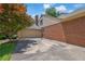 Charming home showing a large driveway, brick facade, and a two-car garage on a sunny day at 1236 Whitlock Ridge Sw Dr, Marietta, GA 30064