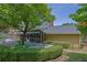 Well-maintained backyard with a covered porch, seating area, and lush landscaping, creating a private outdoor retreat at 1236 Whitlock Ridge Sw Dr, Marietta, GA 30064