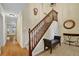 Welcoming foyer with hardwood floors, a staircase, and stylish decor creating a warm atmosphere at 1236 Whitlock Ridge Sw Dr, Marietta, GA 30064