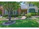 Brick home features a charming front entrance with blue shutters, manicured lawn, and walkway to front door at 1236 Whitlock Ridge Sw Dr, Marietta, GA 30064