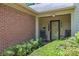 Inviting covered front porch with rocking chairs and a well-maintained landscape, perfect for relaxing at 1236 Whitlock Ridge Sw Dr, Marietta, GA 30064