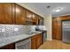 Well-equipped kitchen featuring stainless steel appliances, granite countertops, and stylish backsplash at 1236 Whitlock Ridge Sw Dr, Marietta, GA 30064