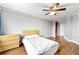 Inviting bedroom with hardwood floors, a ceiling fan, and a scenic outdoor view at 1501 Clairmont Rd # 1213, Decatur, GA 30033