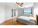 Bright bedroom with hardwood floors, ceiling fan, and large windows offering scenic views at 1501 Clairmont Rd # 1213, Decatur, GA 30033