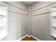 Walk-in closet featuring built-in shelving and ample storage space at 1501 Clairmont Rd # 1213, Decatur, GA 30033