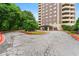 Beautiful condo building exterior with well-maintained landscaping and circular driveway at 1501 Clairmont Rd # 1213, Decatur, GA 30033