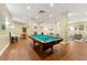 Spacious game room featuring a pool table, bar seating, and a comfortable lounge area at 1501 Clairmont Rd # 1213, Decatur, GA 30033