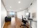 Office space area featuring hardwood floors, neutral walls, recessed lighting, and balcony access at 1501 Clairmont Rd # 1213, Decatur, GA 30033