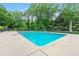Large outdoor swimming pool surrounded by lush greenery, perfect for relaxation at 1501 Clairmont Rd # 1213, Decatur, GA 30033