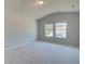 Large bedroom featuring two windows and light-colored carpet and paint at 162 Haverling Pass, Hampton, GA 30252