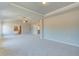 Large bedroom features neutral walls, carpet, and an ensuite bathroom at 162 Haverling Pass, Hampton, GA 30252