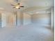 Spacious bedroom boasts carpeted floors, fan, recessed lighting, and neutral walls at 162 Haverling Pass, Hampton, GA 30252