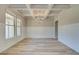Spacious dining room featuring coffered ceilings, wainscotting, and neutral paint at 162 Haverling Pass, Hampton, GA 30252