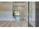Bright foyer with hardwood floors, wainscotting, and an open staircase to the second floor at 162 Haverling Pass, Hampton, GA 30252
