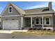 Charming single-Gathering home featuring an attached garage and covered porch at 241 Saratoga Dr, Acworth, GA 30102