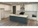 Modern kitchen featuring white cabinets, stainless steel appliances, and a center island with a sink at 241 Saratoga Dr, Acworth, GA 30102
