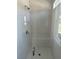 Modern shower showcasing white subway tile, a built-in bench, and glass door at 241 Saratoga Dr, Acworth, GA 30102