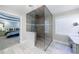 Open bathroom layout with glass enclosed shower and view to the main bedroom at 265 Dogwood Walk Ln, Norcross, GA 30071