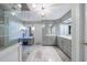 Bright, updated bathroom featuring white cabinets, marble countertops, and glass enclosed shower at 265 Dogwood Walk Ln, Norcross, GA 30071