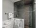 Bathroom featuring a tiled shower with rainfall shower head at 265 Dogwood Walk Ln, Norcross, GA 30071