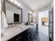 Bright bathroom with double sinks, granite countertops, and modern fixtures at 265 Dogwood Walk Ln, Norcross, GA 30071