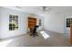 Bright bedroom featuring carpet floors, a ceiling fan, and a built-in desk area with natural lighting at 265 Dogwood Walk Ln, Norcross, GA 30071