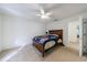 Bedroom with neutral carpet and a white ceiling fan at 265 Dogwood Walk Ln, Norcross, GA 30071
