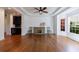 Dining room features hardwood floors, tray ceiling, modern fan, and built in bar at 265 Dogwood Walk Ln, Norcross, GA 30071