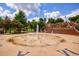 Community splash pad with fountain, mature trees, and landscaping create a lovely park atmosphere at 265 Dogwood Walk Ln, Norcross, GA 30071