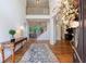 Grand foyer with hardwood floors, staircase, and view of the living spaces at 265 Dogwood Walk Ln, Norcross, GA 30071