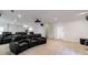 Home theater featuring tiered seating, projector, and surround sound for the perfect viewing experience at 265 Dogwood Walk Ln, Norcross, GA 30071