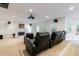 Spacious home theater with comfortable seating, a projector, and a fireplace for an immersive experience at 265 Dogwood Walk Ln, Norcross, GA 30071
