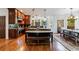 Gourmet kitchen with dark wood cabinetry, granite countertops, and an island with seating at 265 Dogwood Walk Ln, Norcross, GA 30071