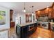 Stylish kitchen featuring stainless appliances, granite island, and ample cabinetry at 265 Dogwood Walk Ln, Norcross, GA 30071