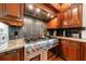 Gourmet kitchen with stainless steel appliances and granite countertops at 265 Dogwood Walk Ln, Norcross, GA 30071