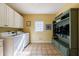 Bright laundry room with washer, dryer, and built-in storage solutions at 265 Dogwood Walk Ln, Norcross, GA 30071