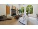 Bright living room with large windows, stone fireplace, and comfortable seating at 265 Dogwood Walk Ln, Norcross, GA 30071