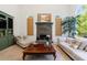 Cozy living room with a stone fireplace, built-in shelving, and comfortable furniture at 265 Dogwood Walk Ln, Norcross, GA 30071